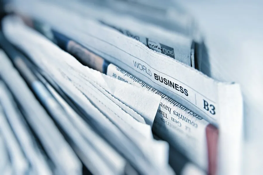 Stack of newspapers illustrating a feature in The National